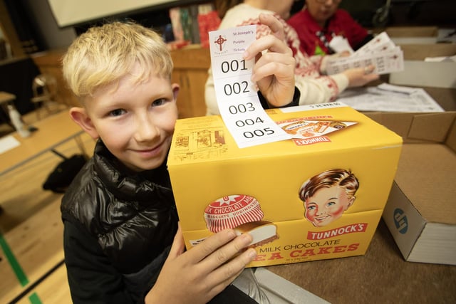 Young Michael Morrow delighted with his Tunnock Teacakes, won at the St. Joseph's Wheel of Fortune on Thursday night. (Photos: Jim McCafferty Photography)