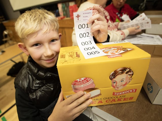 Young Michael Morrow delighted with his Tunnock Teacakes, won at the St. Joseph's Wheel of Fortune on Thursday night. (Photos: Jim McCafferty Photography)