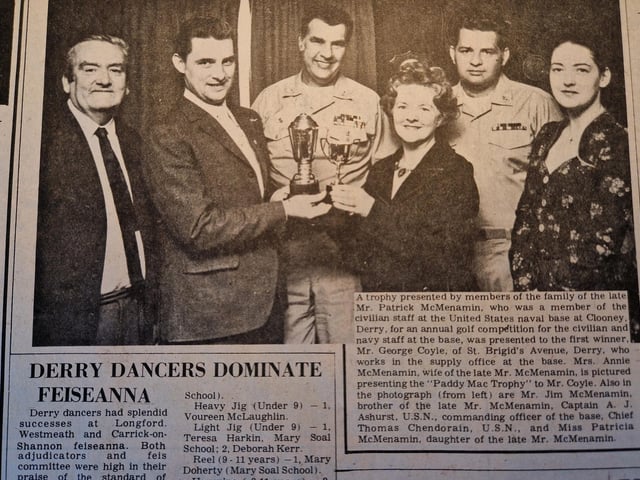 The caption reads: "A trophy presented by members of the family of the late Mr. Patrick McMenamin, who was a member of the civilian staff at the United States Naval base at Clooney, Derry, for an annual golf competition for the civilian and navy staff at the base, was presented to the first winner, Mr. George Coyle, of St Brigid's avenue, Derry, who works in the supple office at the base.