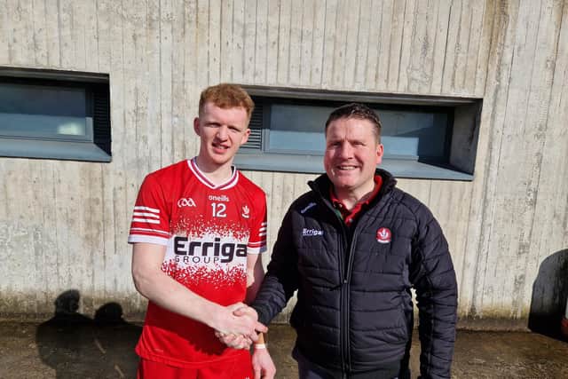 Derry's Darragh McGilligan accepts his 'Man of the Match' award from Dermot Friel of Friel's Bar, Swatragh after Sunday's league victory over Roscommon in Lavey.