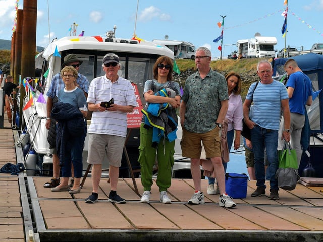 People attend the blessing of the boats at the Fahan Marina on Sunday afternoon. Photo: George Sweeney. DER2326GS - 08
