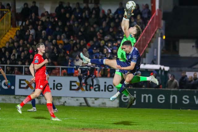 Jordan McEneff challenges Sligo keeper Ed McGinty during the second half. The City midfielder came on to replace the injured Cameron Dummigan.