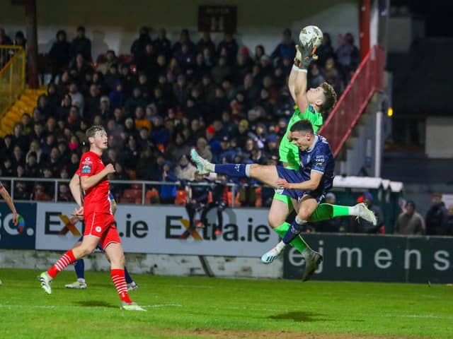 Jordan McEneff challenges Sligo keeper Ed McGinty during the second half. The City midfielder came on to replace the injured Cameron Dummigan.