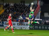 Jordan McEneff challenges Sligo keeper Ed McGinty during the second half. The City midfielder came on to replace the injured Cameron Dummigan.