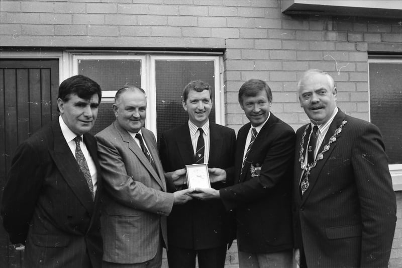 Alex Ferguson receives a gift during his visit to the Brandywell.
