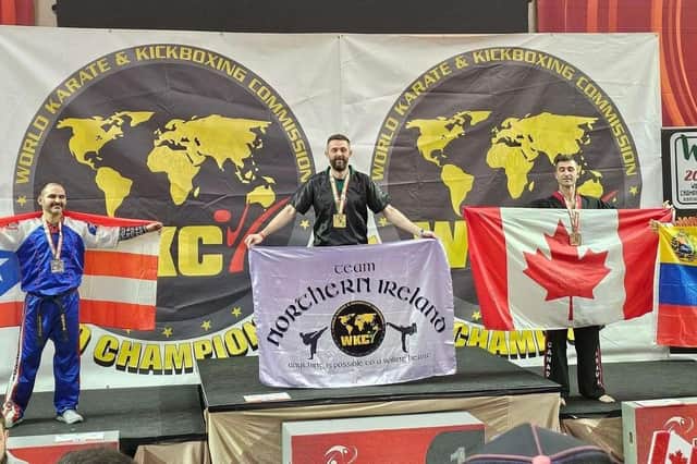 Stephen Brett on the podium at the World Karate and Kickboxing Championships held in Albufeira, Portugal.