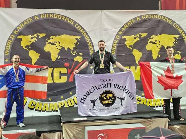 Stephen Brett on the podium at the World Karate and Kickboxing Championships held in Albufeira, Portugal.