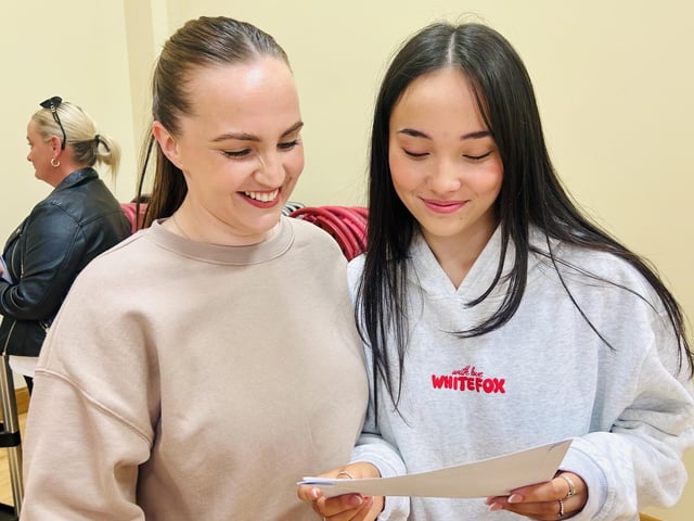 Nattaya Brady enjoys her GCSE success with her sister.