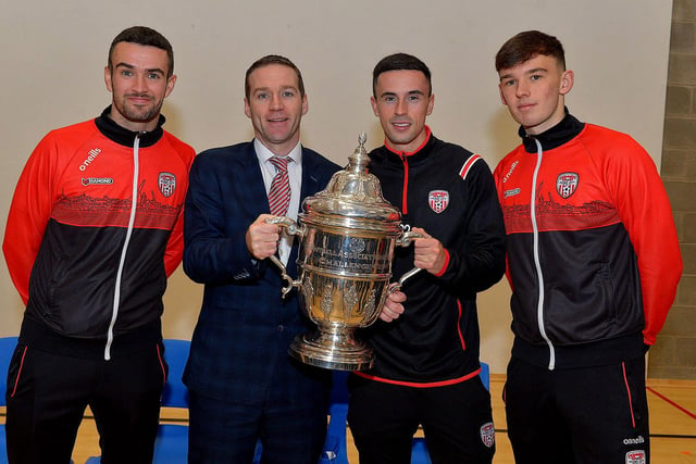 Derry City players Michael Duffy, Jordon McEneff and Liam Mullan, former pupils of St Columb's College, pictured with Mr Ryan Horner during a visit to the school with the FAI Cup, on Monday. Photo: George Sweeney. DER2247GS  31