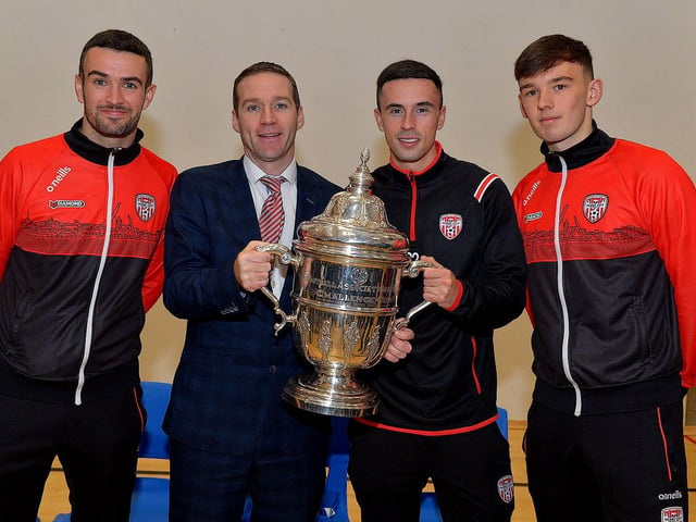 Derry City players Michael Duffy, Jordon McEneff and Liam Mullan, former pupils of St Columb's College, pictured with Mr Ryan Horner during a visit to the school with the FAI Cup, on Monday. Photo: George Sweeney. DER2247GS 31