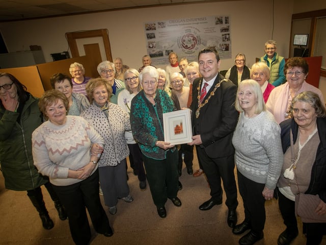 MAYOR'S RATHMOR 50+ WOMEN'S CLUB VISIT. . . . .The Mayor of Derry City and Strabane District Council, Ruairi McHugh receives a special presentation from Margaret McGlinchey, founder of the Rathmor 50+ Women's Club, during Tuesday morning's visit, held as part of his initiative showcasing small community groups. Included is Barbara Sweeney, Administrator, Creggan Enterprises and women from the group. (Photos: Jim McCafferty Photography) : Mayor visits Rathmore 50+ Women's Club.