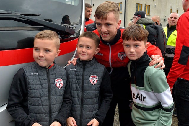 Derry City’s Ciaron Harkin has his picture taken with fans on Saturday morning prior to the team’s departure for Dublin ahead of tomorrow’s FAI Cup Final against Shelbourne. George Sweeney.  DER2244GS – 54