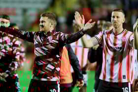 Derry City captain Patrick McEleney and his brother Shane celebrate their FAI Cup semi-final win over Bohemians in front of the travelling fans at Dalymount. Photo: Kevin Moore/MCIphoto