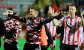 Derry City captain Patrick McEleney and his brother Shane celebrate their FAI Cup semi-final win over Bohemians in front of the travelling fans at Dalymount. Photo: Kevin Moore/MCIphoto
