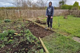Getting mucky extending the planting patch for flowers and vegetables.