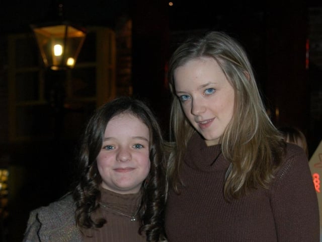 Anna celebrating her birthday with family and friends at the bowling alley.