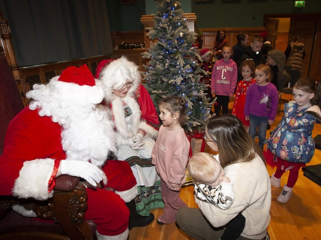 Whispering to Santa what the Christmas list includes this year, during Saturday’s Mayor’s Magical Christmas Experience in the Guildhall.:.