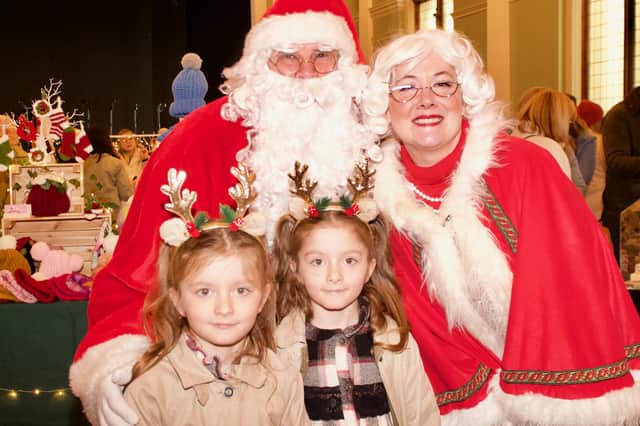 Mr and Mrs Claus with young helpers at the Derry Business Collective’s Christmas Market in St. Columb’s Hall, on Sunday December 3.