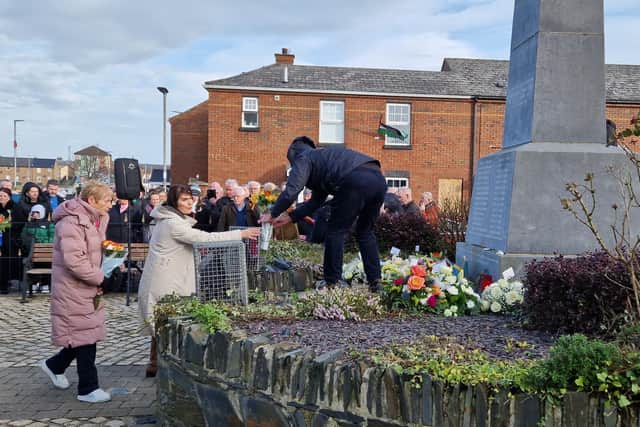 Relatives leave wreaths at the Bloody Sunday monument at the annual Service.