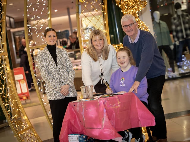 Louise Moorhead,Arts Development Officer, Gasyard Centre pictured with Tori and her mum and grandad on Wednesday at Lisnagelvin Shopping Centre.