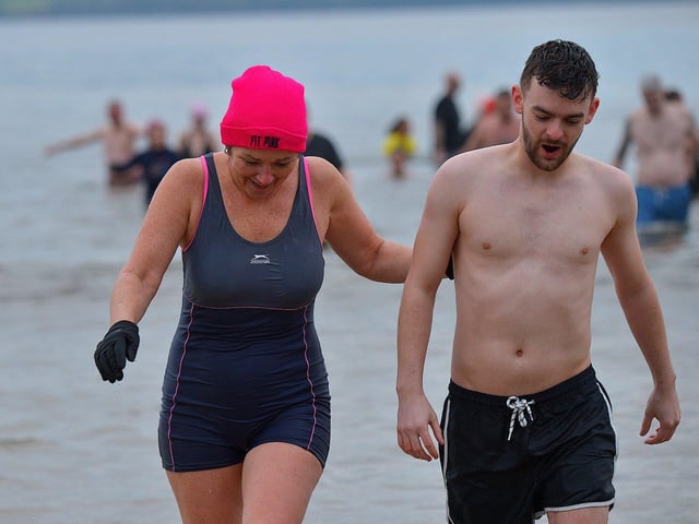 Some of the swimmers taking part in the annual ARC Fitness New Years Day Charity Swim at Lisfannon beach. Photo: George Sweeney. DER2301GS 11