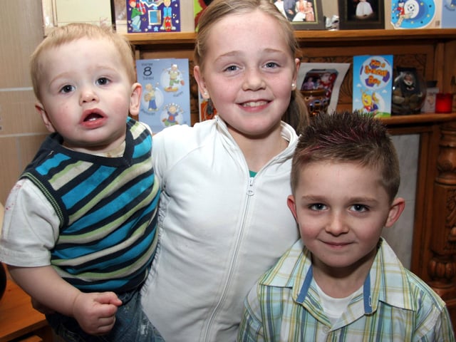 Birthday boy Sean poses for the photographer with sister Caoimhe and brother conan 0011JML : Parties and nights out in March 2006