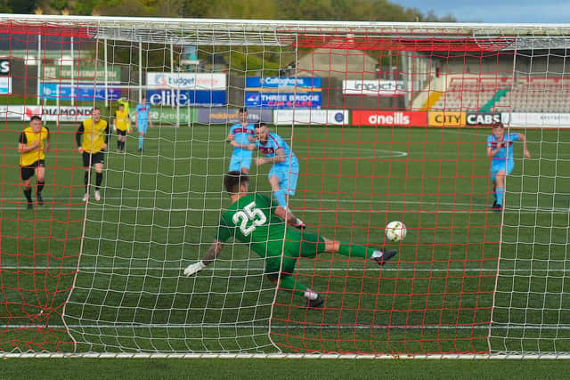 Institute’s Cathair Friel scores from the penalty spot, sending Knockbreda goalkeeper Jonah Nicholl the wrong way. DER2243GS – 082