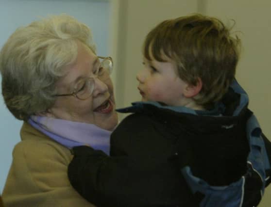 Mary McCloskey of Derry hugs her granson Callum on his arrival at City of Derry Airport with mum Lisa. (2312JB31)