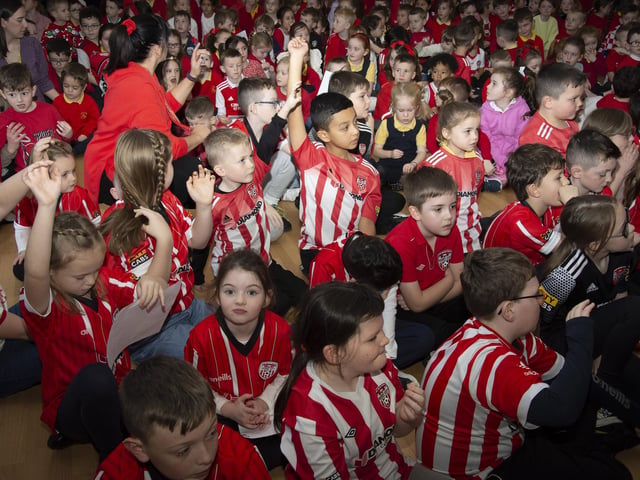 Excited pupils from Steelstown Primary School greet Derry City players Michael Duffy and Patrick and Shane McEleney on Tuesday morning ahead of Sunday FAI Cup Final. (Photo: Jim McCafferty)