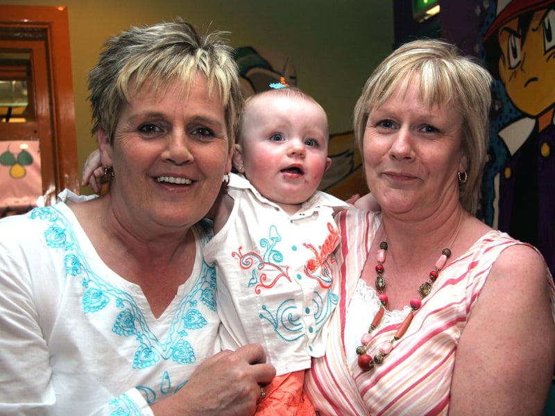 Granny Chiree and Granny Margaret smile for the camera with birthday girl Kasey 0539JML : Parties and celebrations June 2006: Casey McCourt.