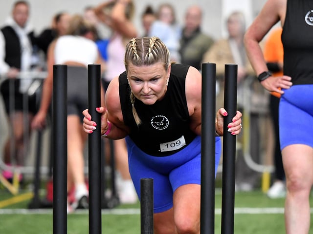 Christine Bonner pushes the sled at the Maiden City Hyrox IV held at Sean Dolans GAC.  Photograph: George Sweeney