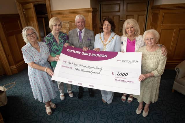 FACTORY GIRLS CHEQUE. . . .The outgoing Mayor of Derry City and Strabane District Council, Patricia Logue pictured at the Guildhall on Friday accepting a cheque for £1,000, proceeds from the recent Factory Girls Dance in the Guildhall. Included from left are Clare Moore, Mary Doherty, Willie Deery, Mary White and Isabel Doherty. (Photos: Jim McCafferty Photography)