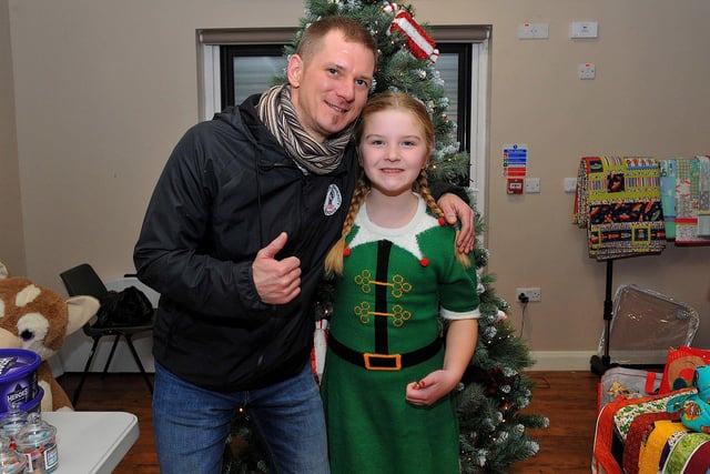 Colly McLaughlin with his daughter Faela at the Galliagh Community Response Christmas Craft Fair held in Pio House Parish Centre on Saturday, in aid of Foyle Down Syndrome Trust.  Photo: George Sweeney. DER2250GS – 85