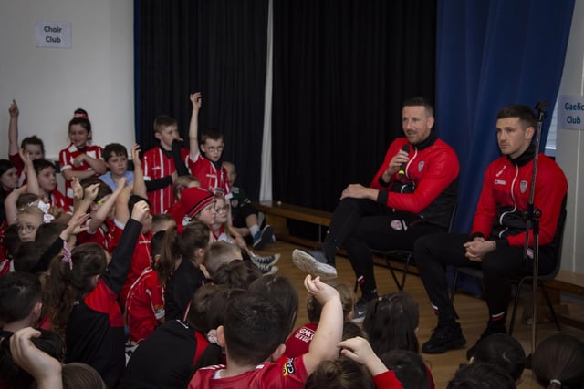 Derry City players Shane and Patrick McEleney take questions from pupils during their visit to Steelstown Primary School on Tuesday. (Photo: Jim McCafferty)