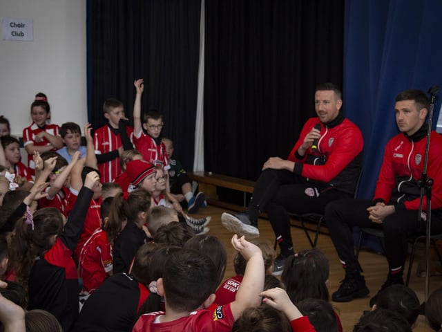 Derry City players Shane and Patrick McEleney take questions from pupils during their visit to Steelstown Primary School on Tuesday. (Photo: Jim McCafferty)