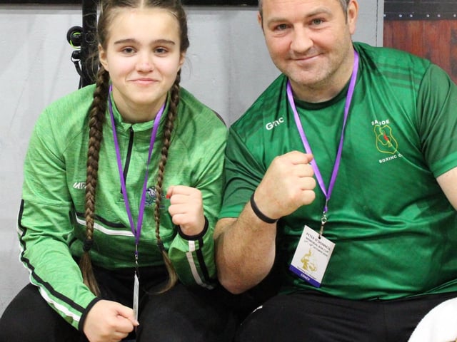 A young boxer and coach pictured at the Peter O’Donnell Box Cup