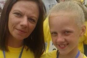 An old photograph of Leah (aged 10) participating in the Foyle Hospice Female Walk with her late mother Muranna.