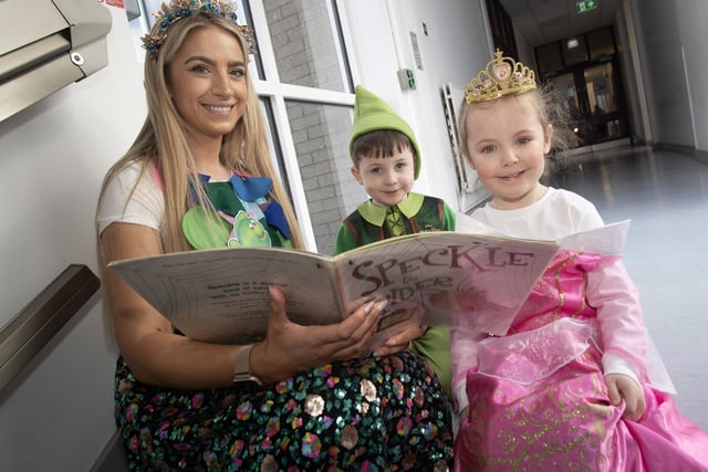 Primary 1 teacher Mrs. O'Donnell reading a story to some of her pupils during World Book Day at the school.
