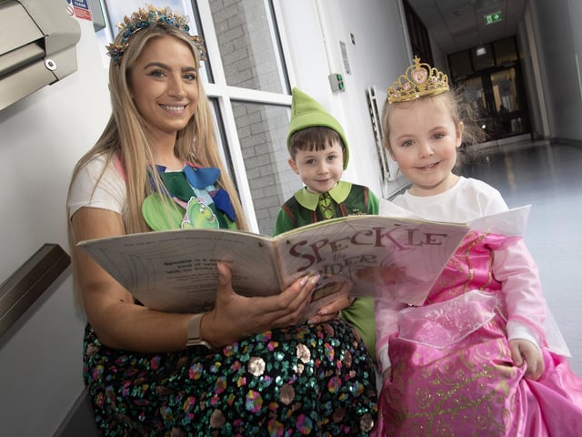 Primary 1 teacher Mrs. O'Donnell reading a story to some of her pupils during World Book Day at the school.
