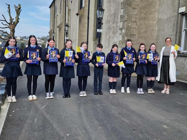 Children from the Scoil Naomh Iosaf Community Choir with Principal Andrea Long.