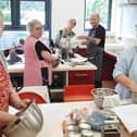 Apex tenants taking part in one of the in-person Cook Along sessions held in Apex Living Centre in Derry