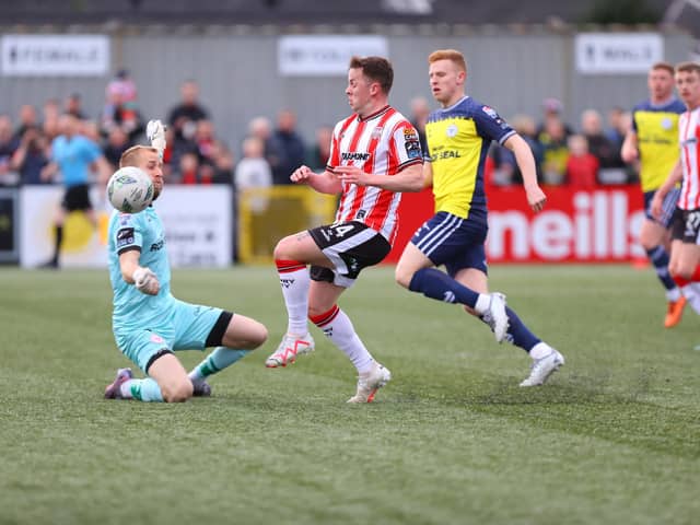 Shelbourne keeper Conor Kearns gets a strong hand to the ball to deny Ben Doherty in the first half.