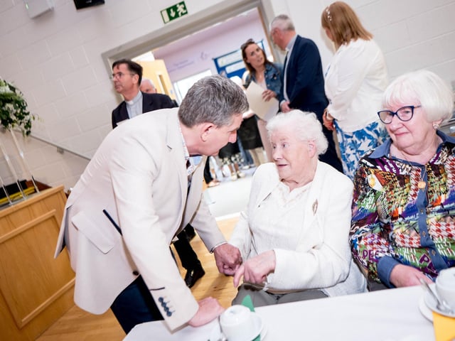 Daniel O'Donnell greets a guest at the Afternoon Tea with Daniel O'Donnell on Sunday in St Mary's College, Derry, in conjunction with St Eugene's Cathedral. Picture: Stephen Latimer.