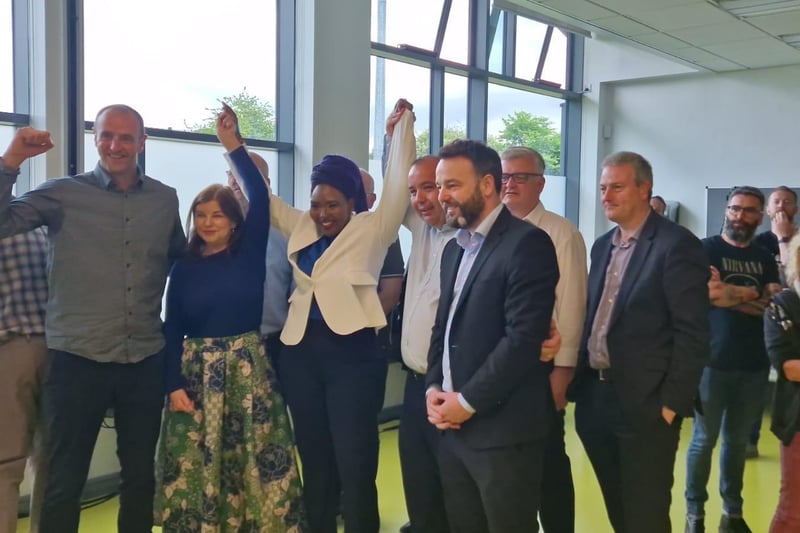 SDLP Councillor Lilian Seenoi-Barr celebrates with SDLP Leader and Foyle MP Colum Eastwood and MLAs Mark H Durkan and Sinéad McLaughlin and Councillor Brian Tierney following her re-election alongside fellow SDLP Councillor Shauna Cusack to represent the people of Foyleside.
