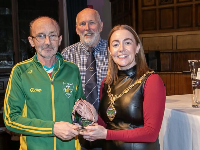 Brian Anderson, coach of Caoimhin Connolly, receiving the Young Male Boxing award on his behalf from the Mayor, Grace Ui Niallais at the Annual Derry City and Strabane District Sports Awards 2026 in the Guildhall on Thursday night. Back centre is Bill Anderson, Chair, Sports Council. (Photos: Jim McCafferty Photography)