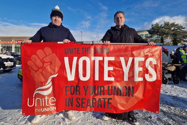 People Before Profit Councillor Shaun Harkin, on right, behind a Seagate union recognition banner at the public sector strike march last week.