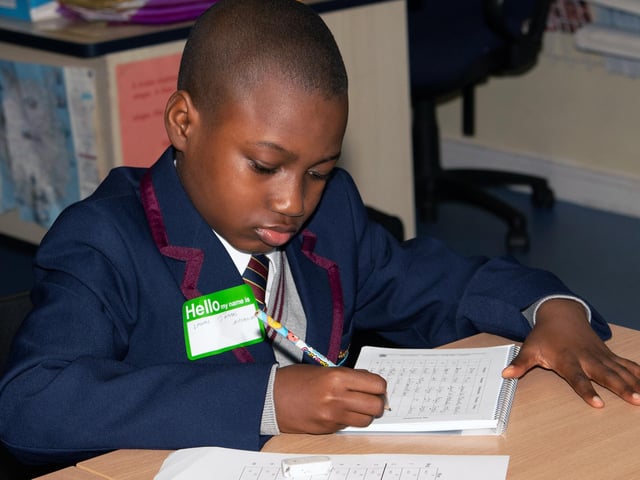 Year 8 student Lawal Jammal Ayomikun working on his timetable on Monday at Oakgrove. : Oakgrove Integrated College welcomes latest influx of Year 8 pupils