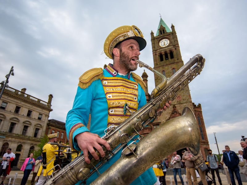 Mr Wilson’s Second Liners take to the streets of Derry as they add a jazz twist to pop music as they make their way round the city centre and into Guildhall Square . Picture Martin McKeown. 03.05.24