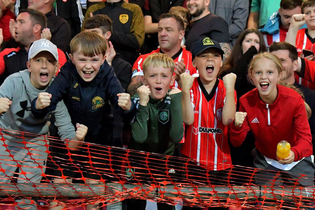 Fans celebrate Derry City’s win over KuPs at the Brandywell. Photo: George Sweeney.DER2330GS -