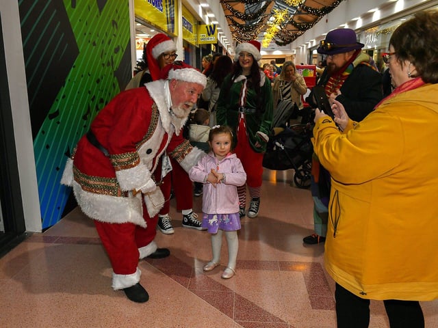 Santa arrives at the Richmond Shopping Centre on Sunday afternoon. Photo: George Sweeney